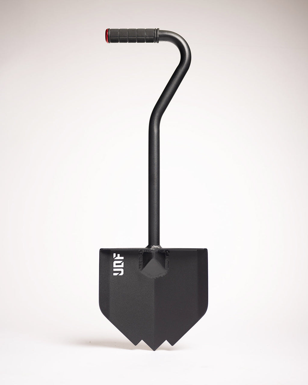 Black overland shovel with a pointed blade, bent handle and rubber grip, on a white background