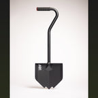 Black overland shovel with a pointed blade, bent handle and rubber grip, on a white background